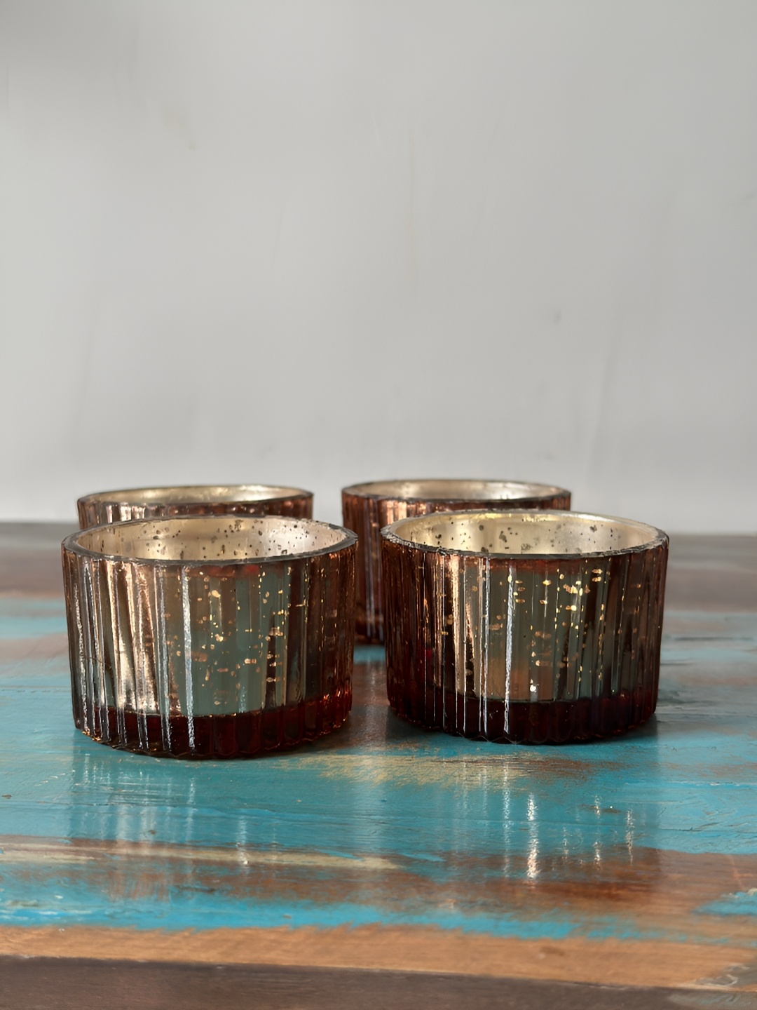 

NURTURE INDIA Copper Toned 4 Pieces Textured Antique Candle Holder