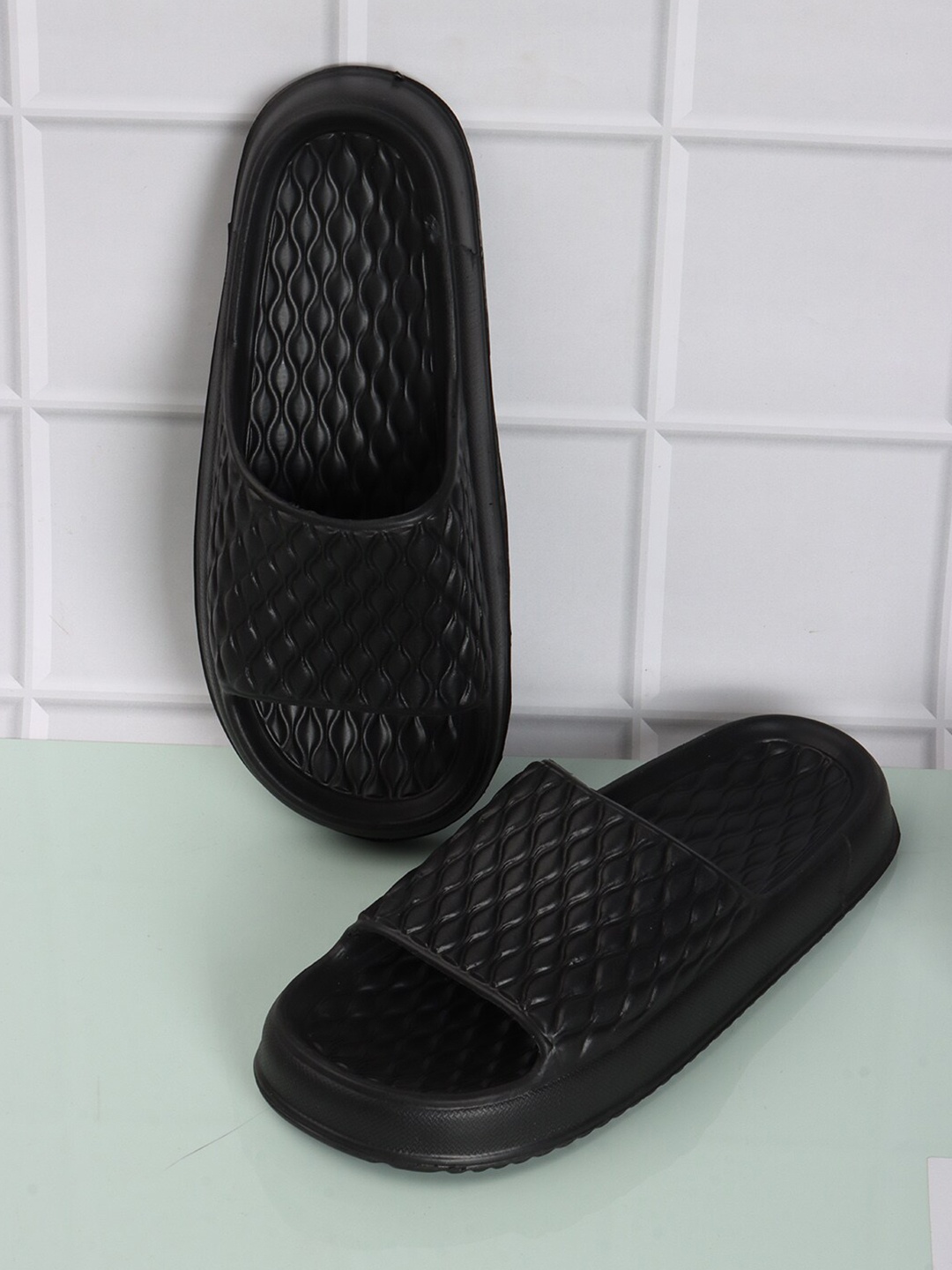 

The Roadster Lifestyle Co. Men Black Textured Lightweight Slider Flip Flops