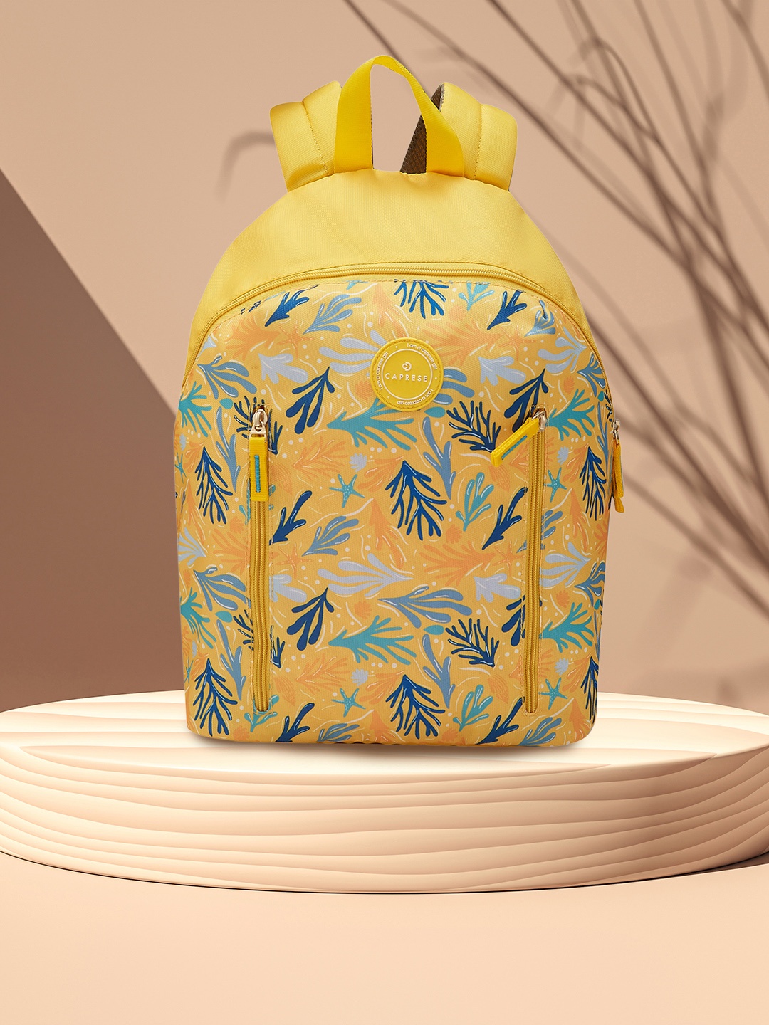 

Caprese Women Xenia Tropical Printed Backpack, Yellow