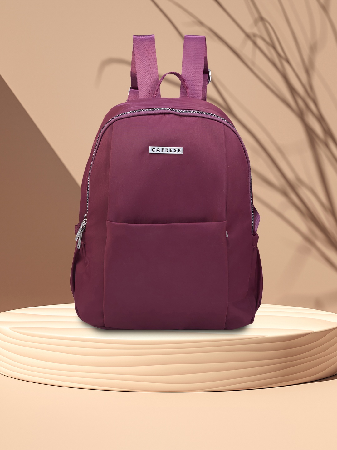 

Caprese Women Ximena Solid Backpack, Burgundy