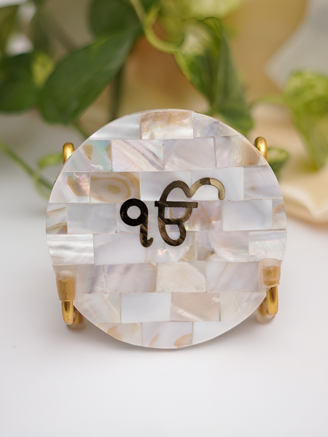 

HOMEARTE Off White Ik Onkar Mother of Pearl with Metal Holder Religious Idol Showpiece