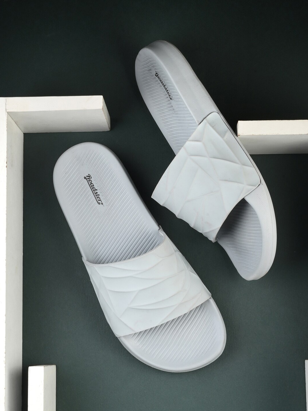 

The Roadster Lifestyle Co. Men Grey Textured Rubber Sliders