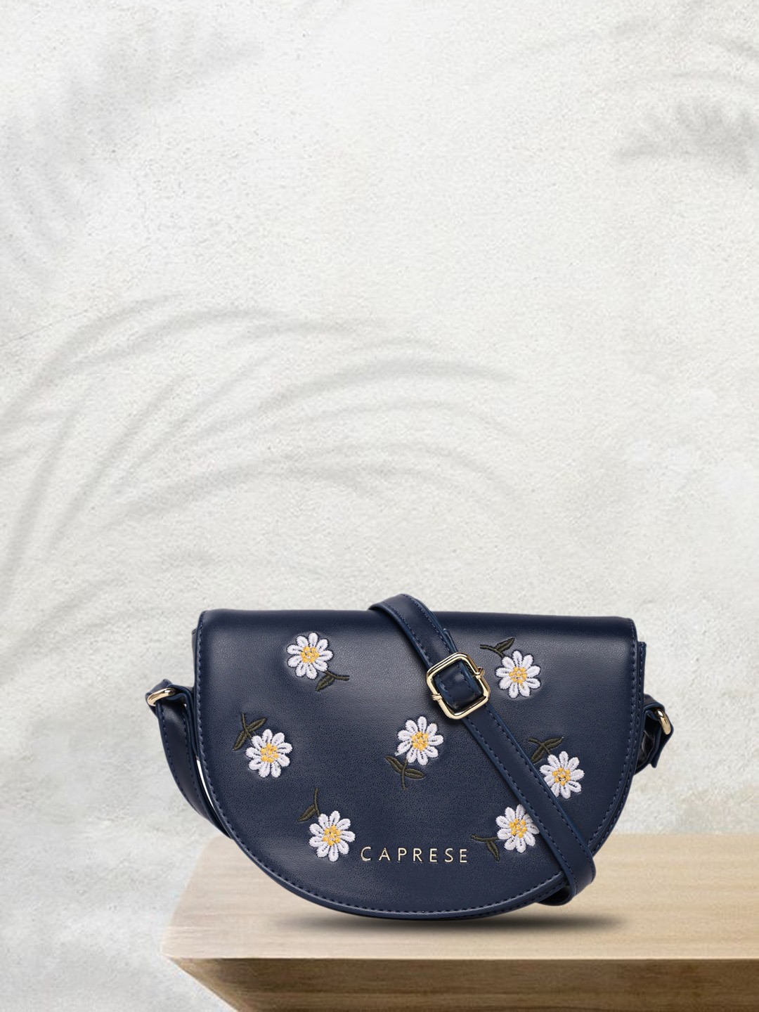 

Caprese Floral Embroidered Half Moon Sling Bag, Blue