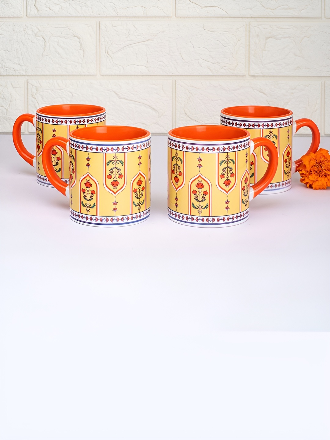

Strokes by Namrata Mehta Yellow & Red 4Pcs Printed Ceramic Glossy Mugs 175ml Each
