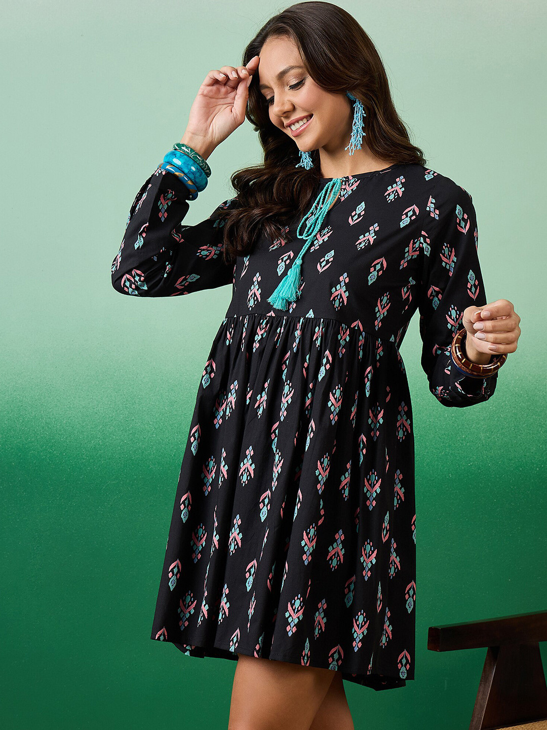 

Sangria Black Ethnic Motifs Printed Tie-Up Neck Cotton Fit & Flare Ethnic Dress