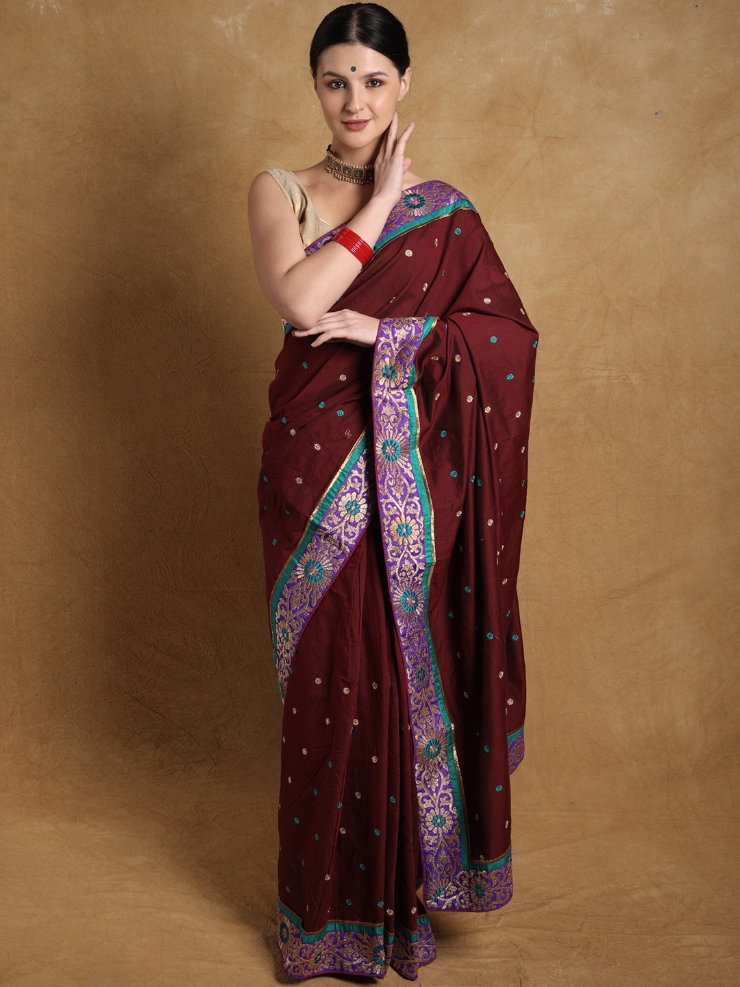 

Exotic India Red Pear Zari Embroidered Bootis Georgette Saree with Floral Patch Border