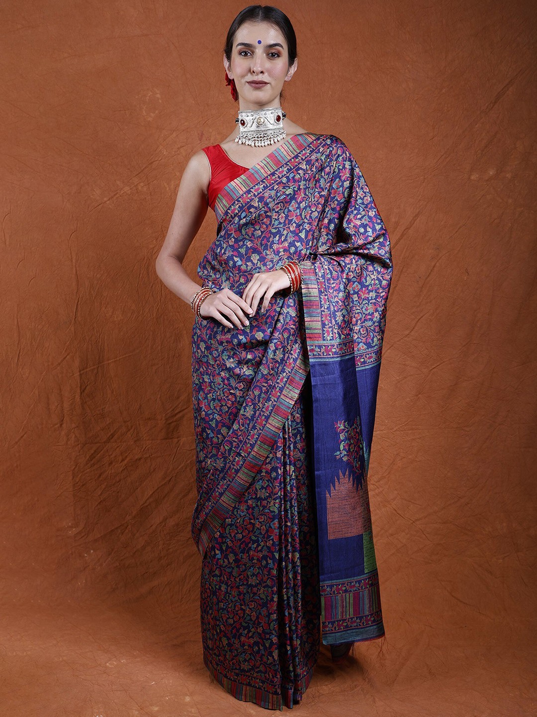 

Exotic India Evening Blue Art Silk Printed Multi-Colored Flowers Kani Saree