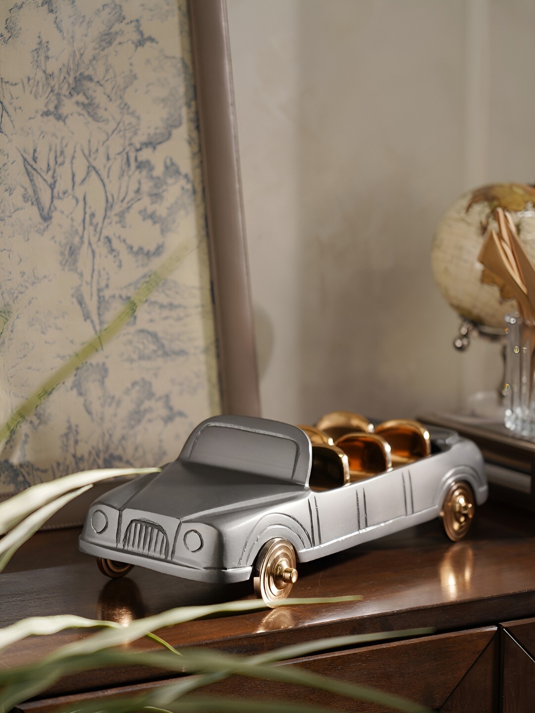 

Pure Home and Living Grey & Gold Toned Curio Showpiece