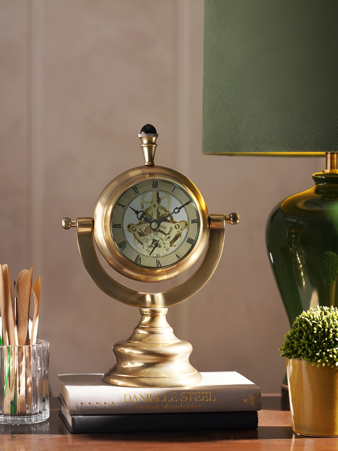 

Pure Home and Living Gold-Toned & Green Curio Showpiece