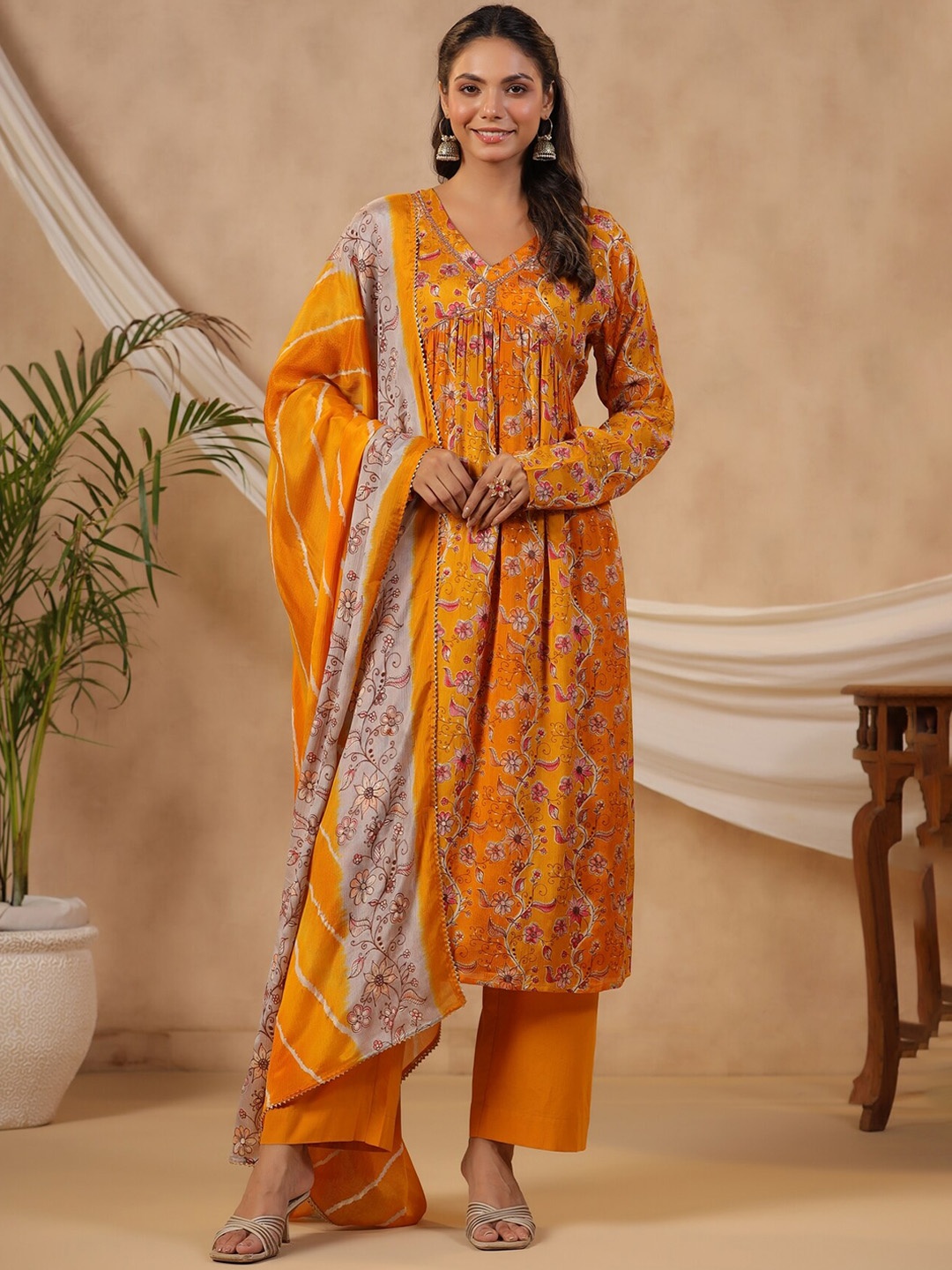 

KALINI Floral Printed Regular Beads And Stones A Line Kurta With Trousers & Dupatta, Mustard