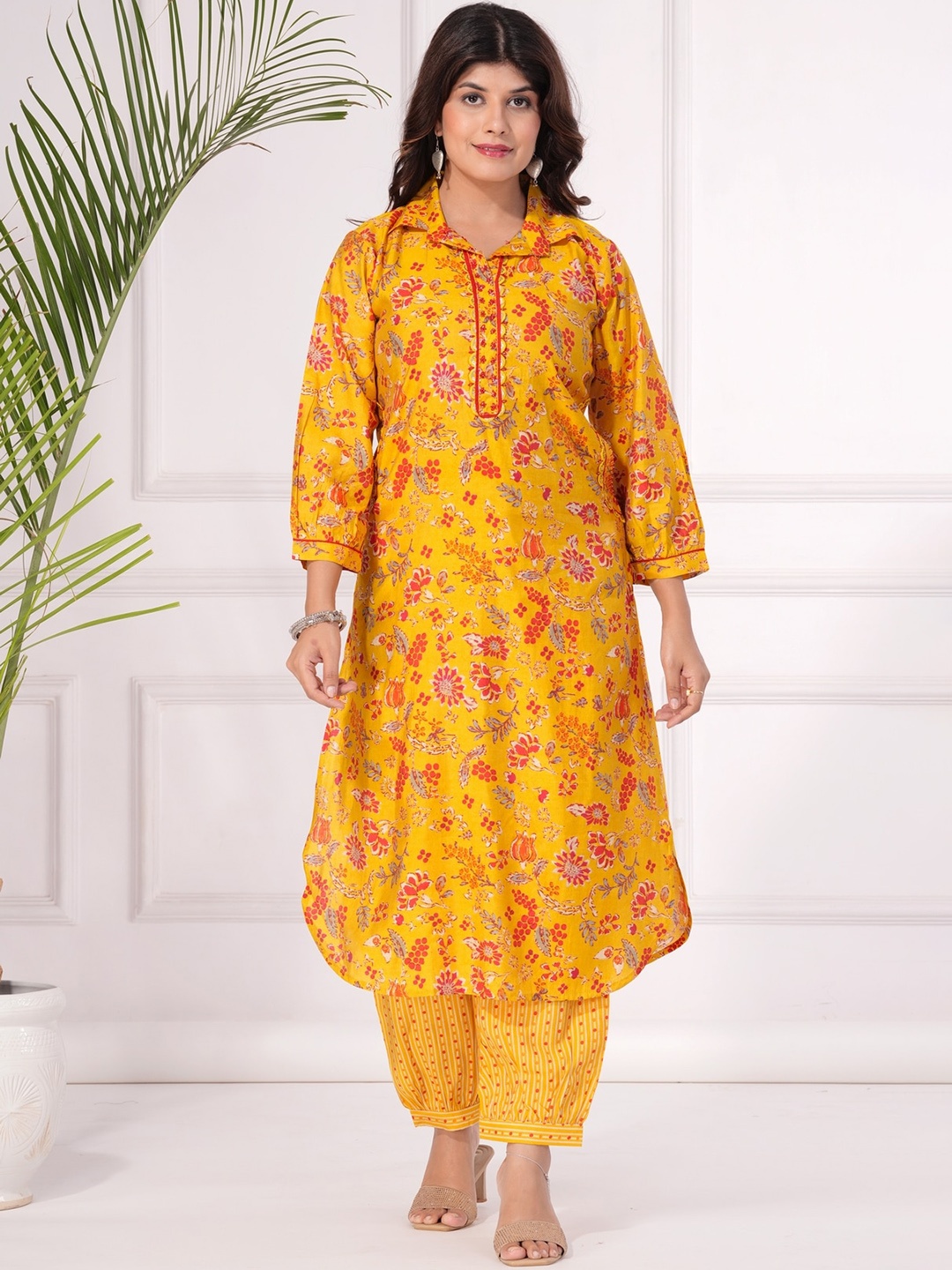 

KALINI Floral Printed Regular Beads and Stones Kurta with Trousers, Yellow