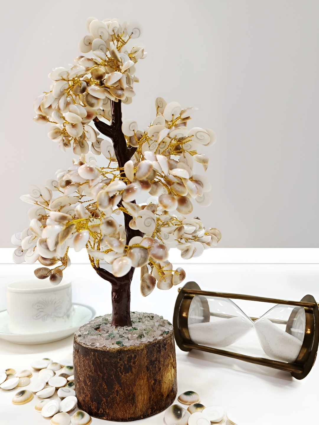 

Shubhanjali White & Gold Toned Textured Crystal Curio Showpiece