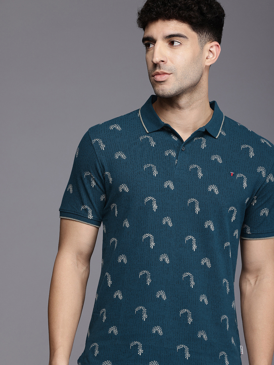 

Louis Philippe Jeans Tropical Printed Polo Collar Pure Cotton Slim Fit T-shirt, Teal