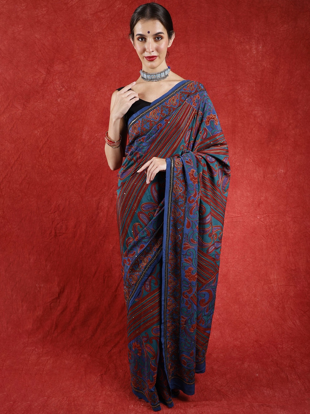 

Exotic India Floral Embroidered Pure Crepe Saree, Blue