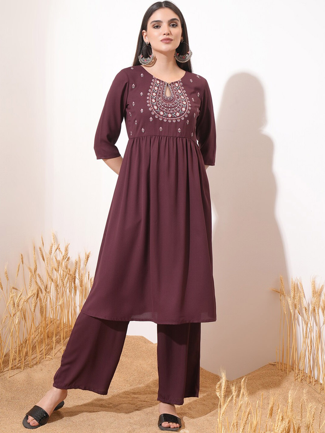 

Vishudh Burgundy Ethnic Motifs Yoke Design Keyhole Neck A-Line Kurta With Palazzos