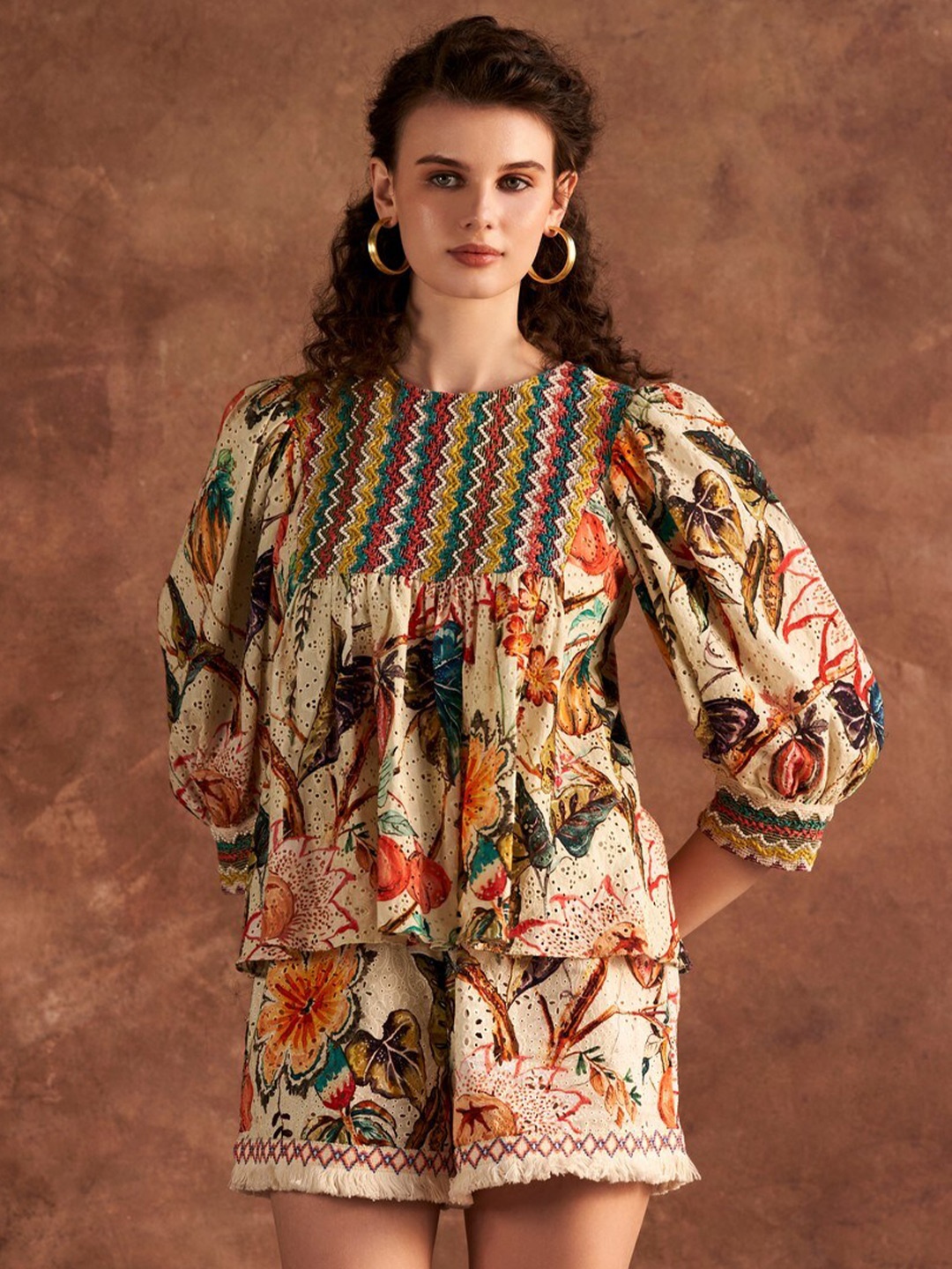 

VERB BY PALLAVI SINGHEE Floral Printed Puff Sleeves Embroidered Cotton Peplum Top, Beige