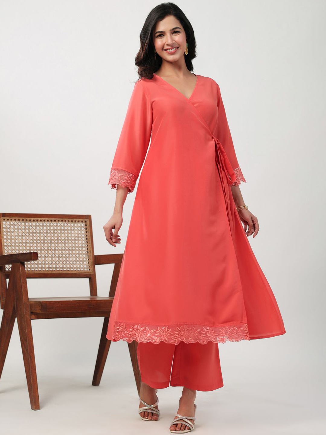 

Janasya Lace Inserted V Neck Angrakha Style A Line Kurta With Palazzos, Peach