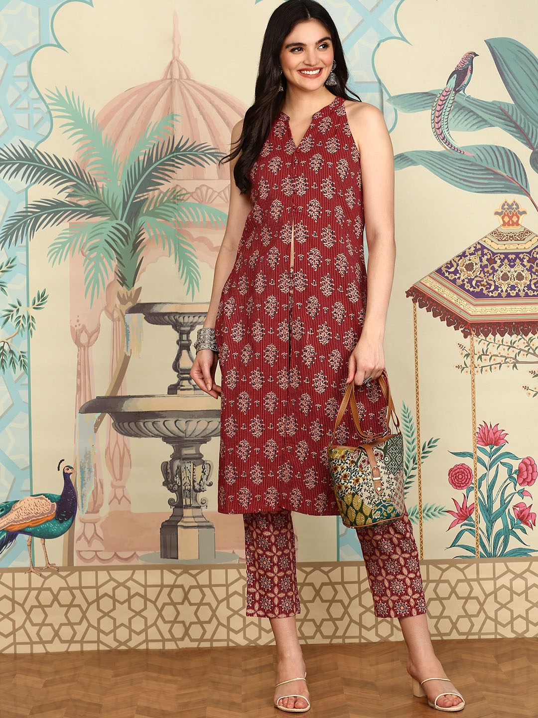 

Ishin Maroon Ethnic Motifs Printed High Slit Chanderi Cotton A-Line Kurta With Trousers