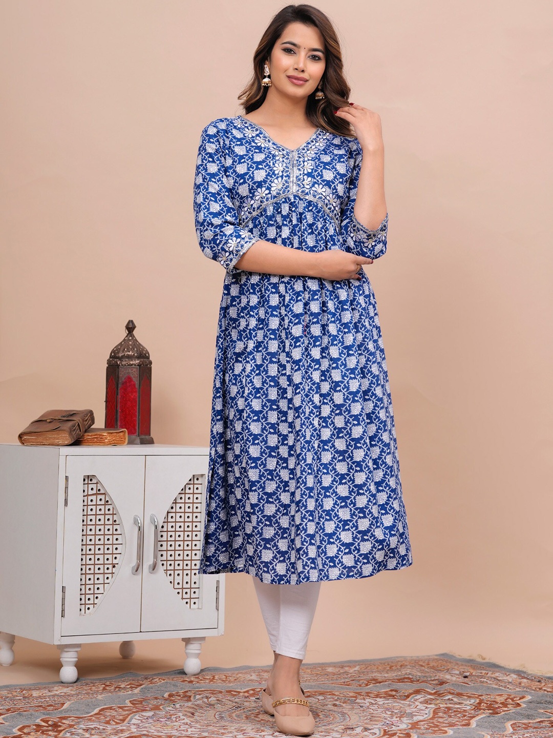 

Light Daisy Ethnic Motifs Printed Sequinned Empire A-Line Kurta, Blue