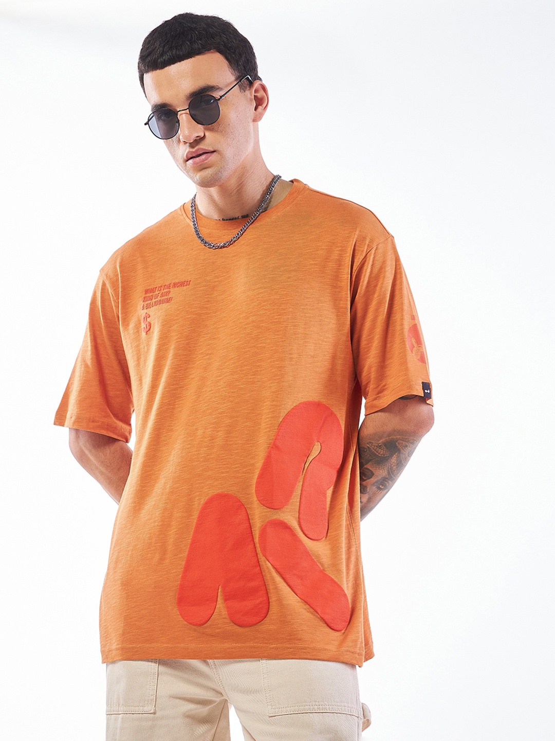 

Bewakoof Air 1.0 Men Orange Billionaire Graphic Printed Oversized T-shirt