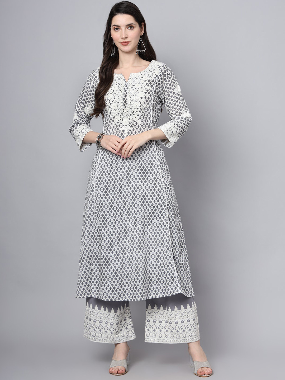 

Divena Floral Embroidered Round Neck Three-Quarter Sleeves Mirror Work Kurta with Palazzos, Purple