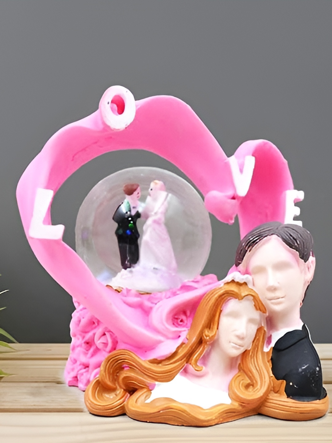 

Aura Pink & Brown Polyresin Figurine Showpiece
