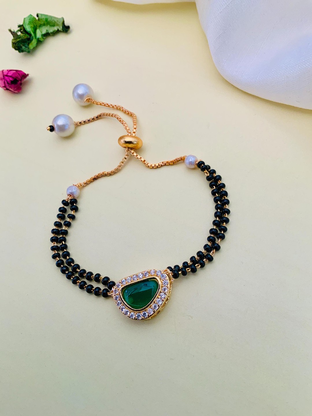

Anouk Gold-Plated Mother Of Pearl-Studded and Beaded Hand Mangalsutra