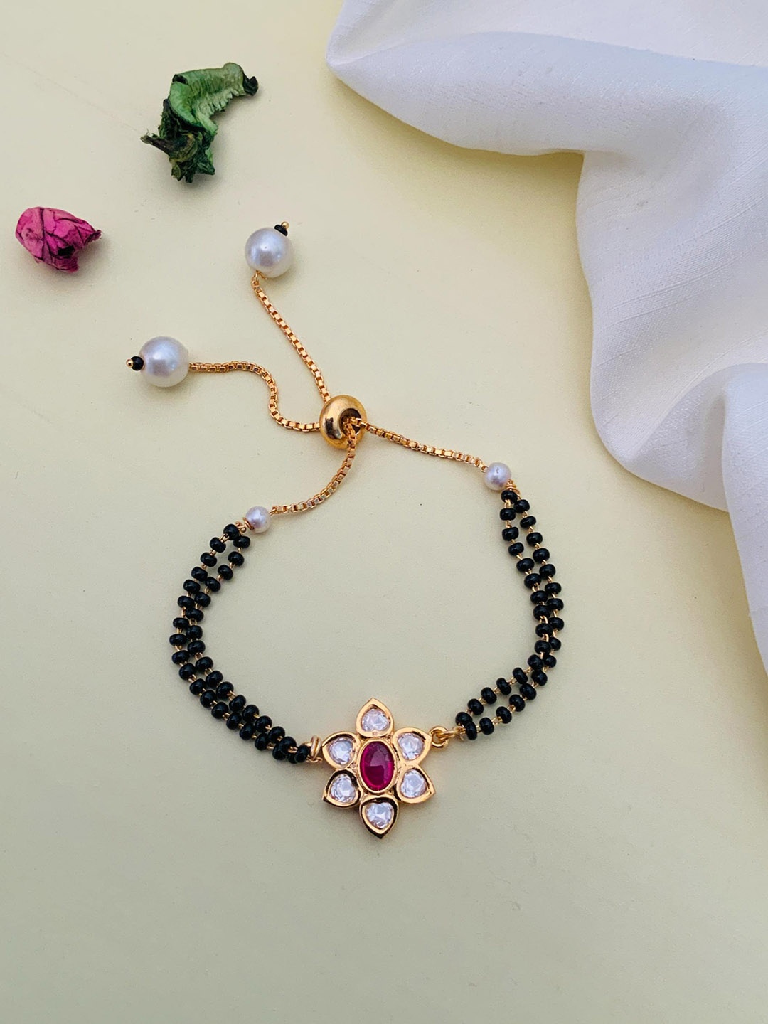 

Anouk Gold-Plated Stone-Studded and Beaded Hand Mangalsutra