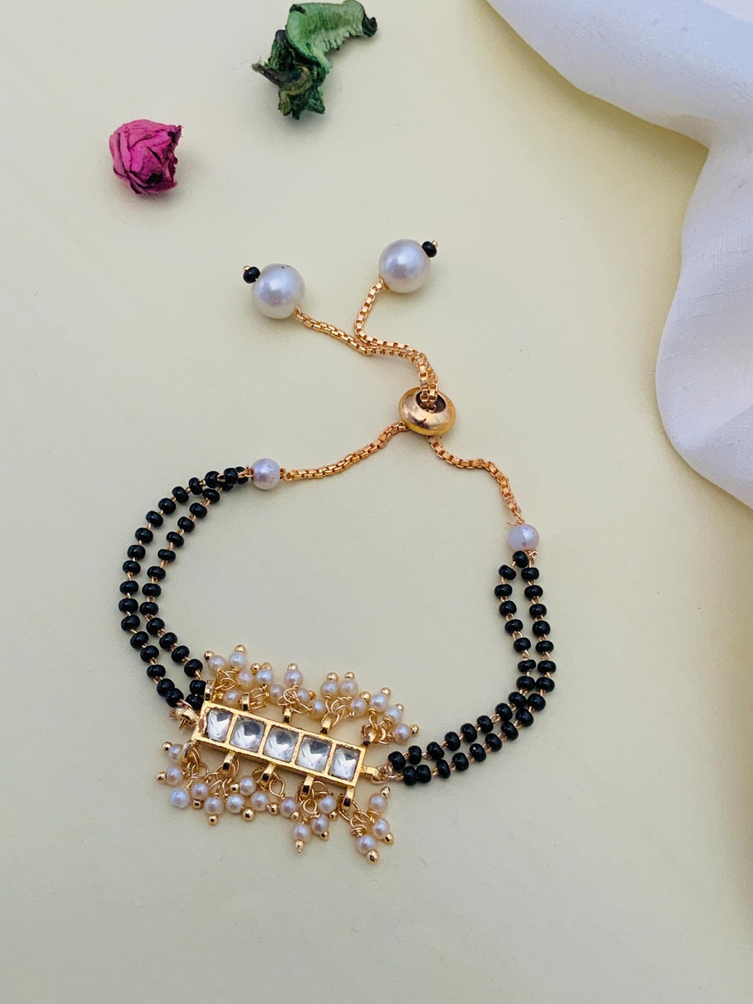 

Anouk Gold-Plated Stone-Studded and Beaded Hand Mangalsutra