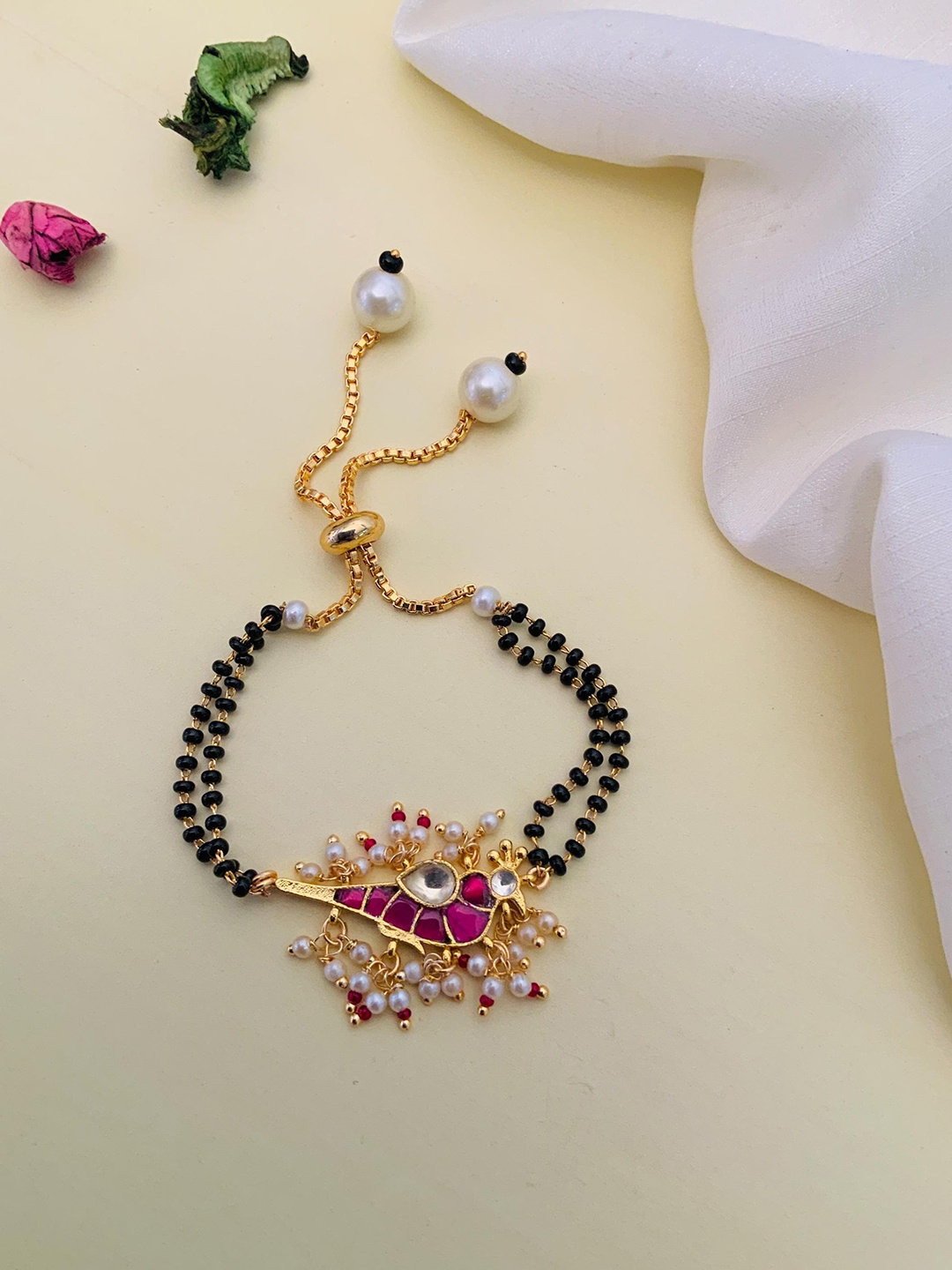 

Anouk Gold-Plated Stone-Studded and Beaded Hand Mangalsutra