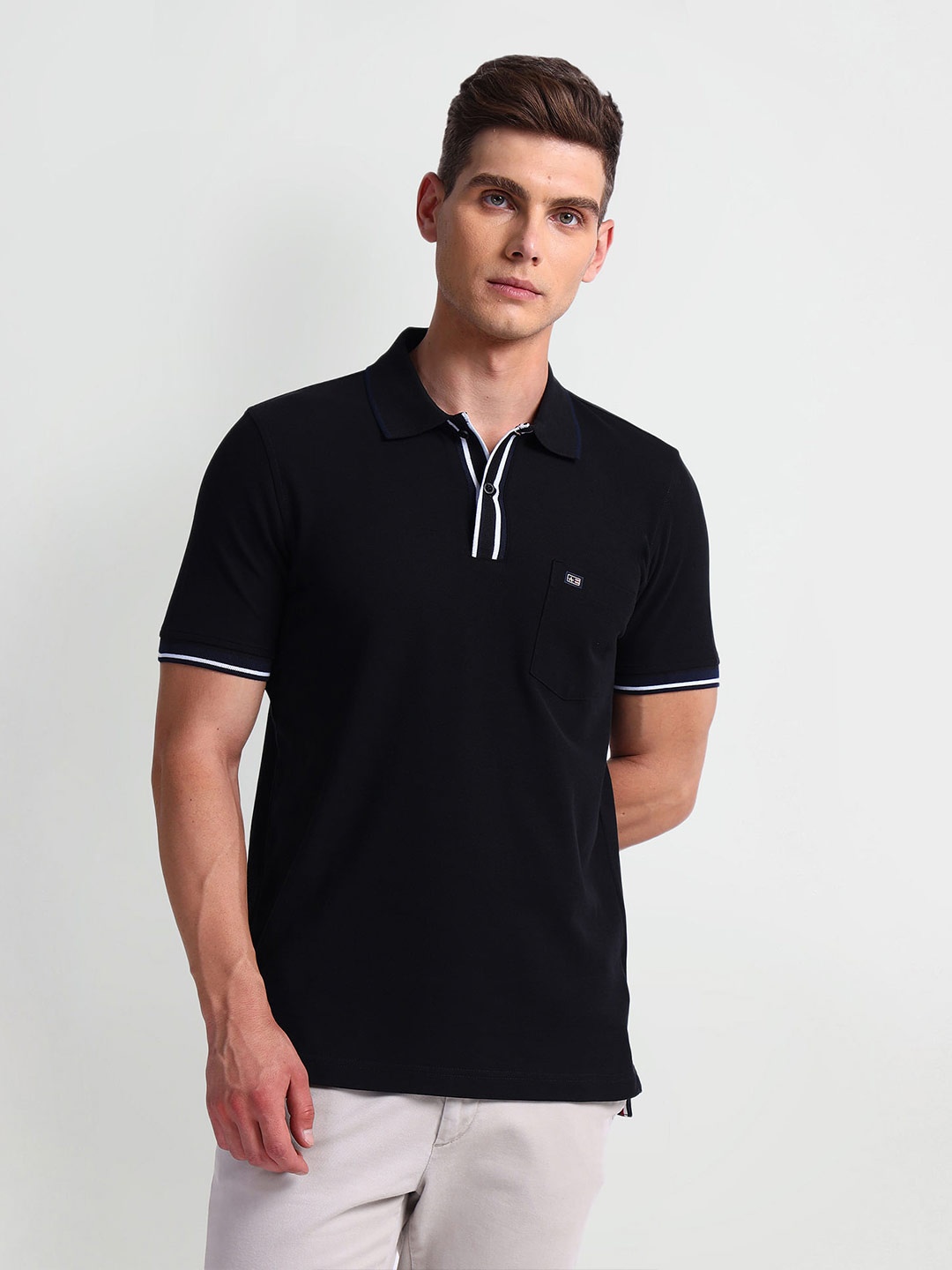 

Arrow Sport Men Solid Polo Collar T-shirt, Black