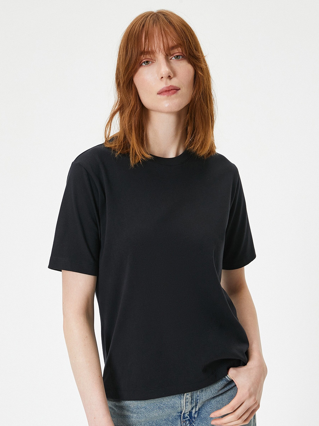 

Koton Women Solid Round Neck T-shirt, Black