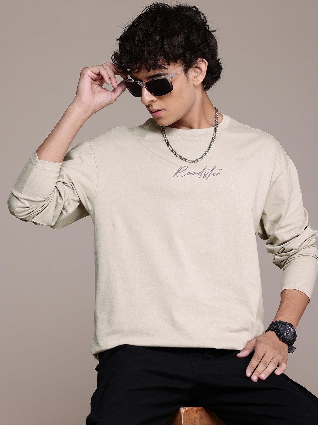 

The Roadster Lifestyle Co. Typography Printed Drop-Shoulder Sleeves Pure Cotton T-shirt, Beige