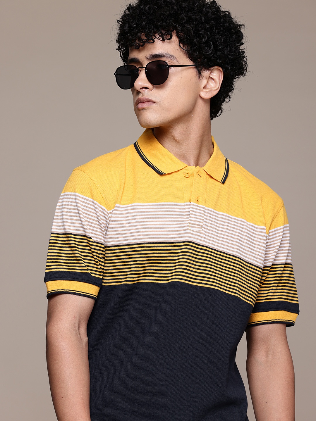 

The Roadster Lifestyle Co. Men Striped Polo Collar T-shirt, Yellow