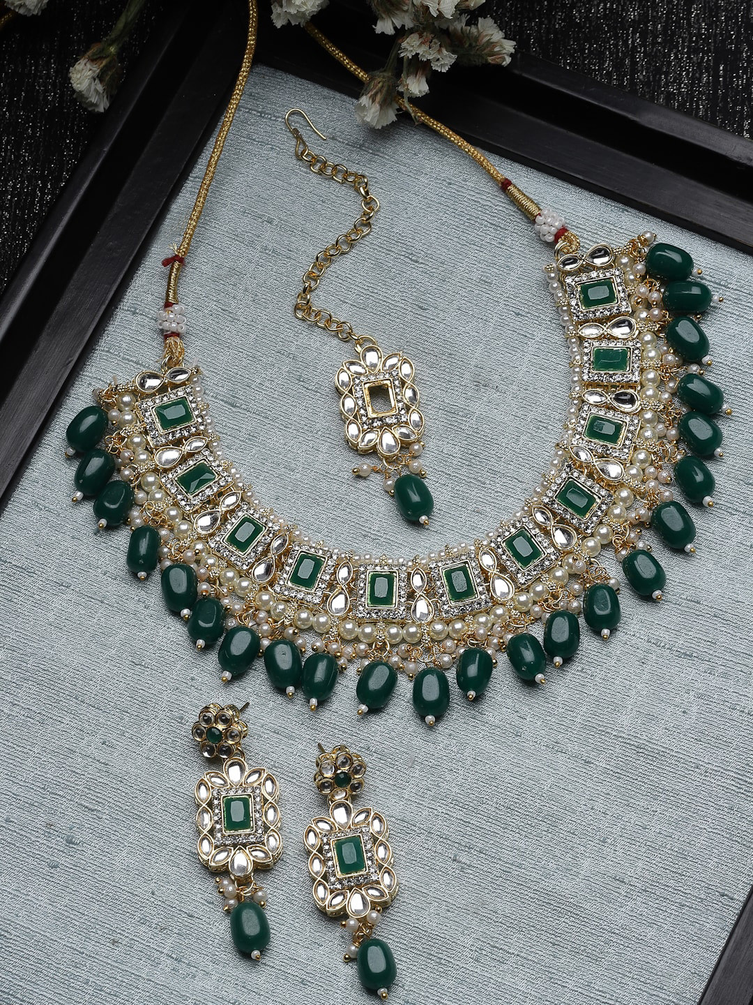 

Sukkhi Gold Plated American Diamond Studded & Beaded Jewellery Set