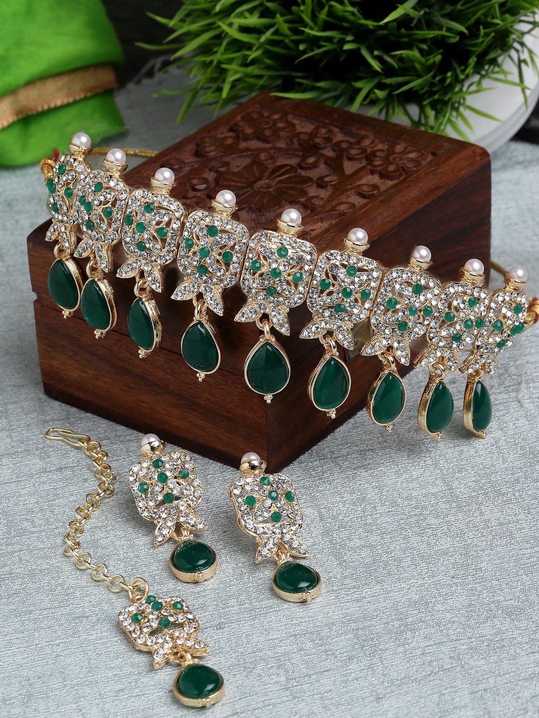 

Sukkhi Gold Plated American Diamond Studded & Beaded Jewellery Set