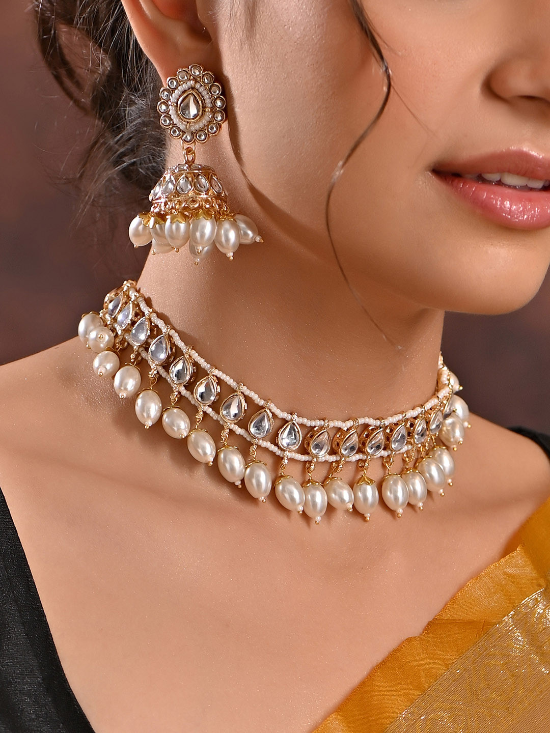 

Fida Gold Plated Stones Studded & Pearls Beaded Jewellery Set