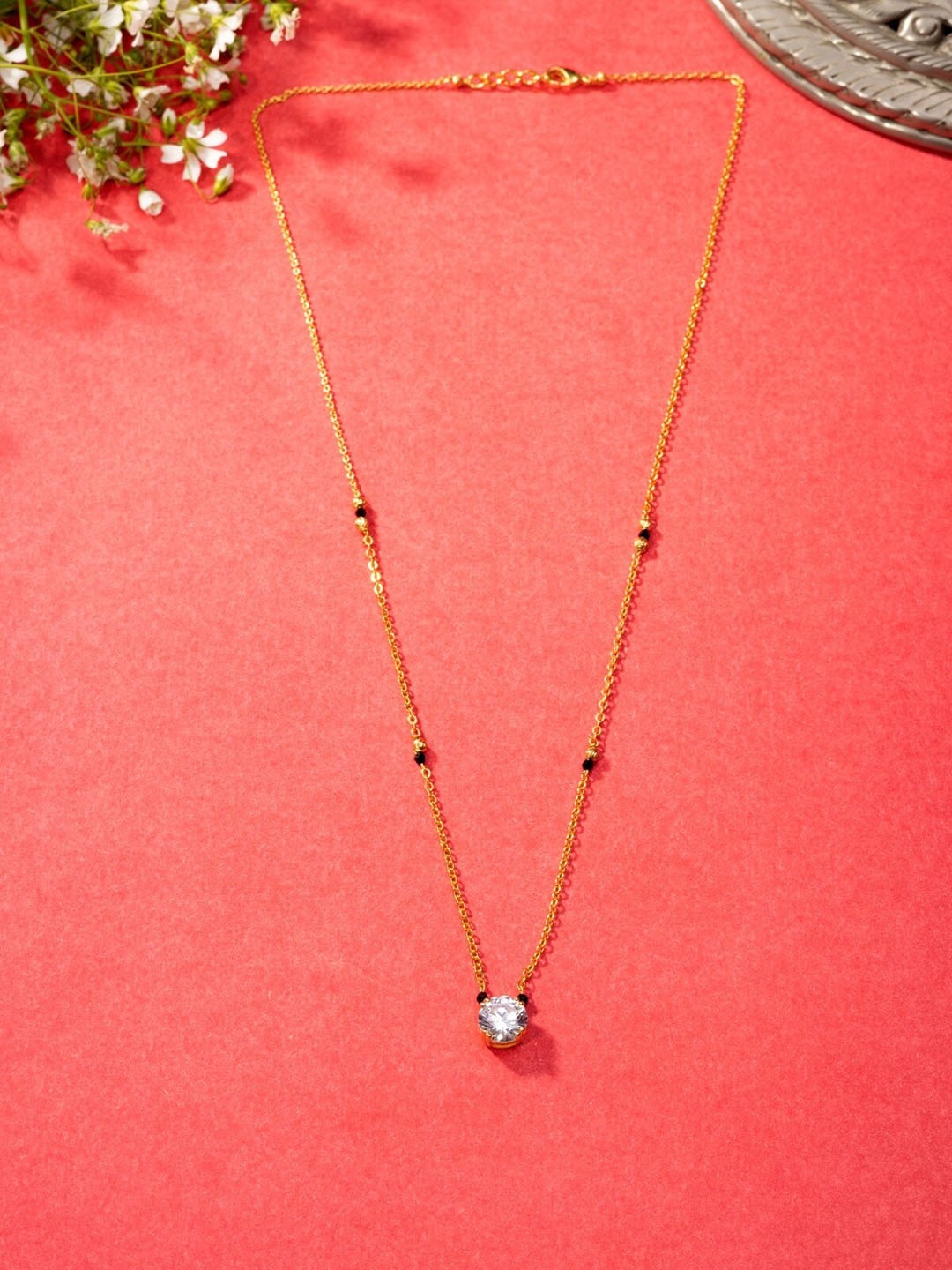 

Niscka Gold-Plated Stones Studded and Beaded Mangalsutra