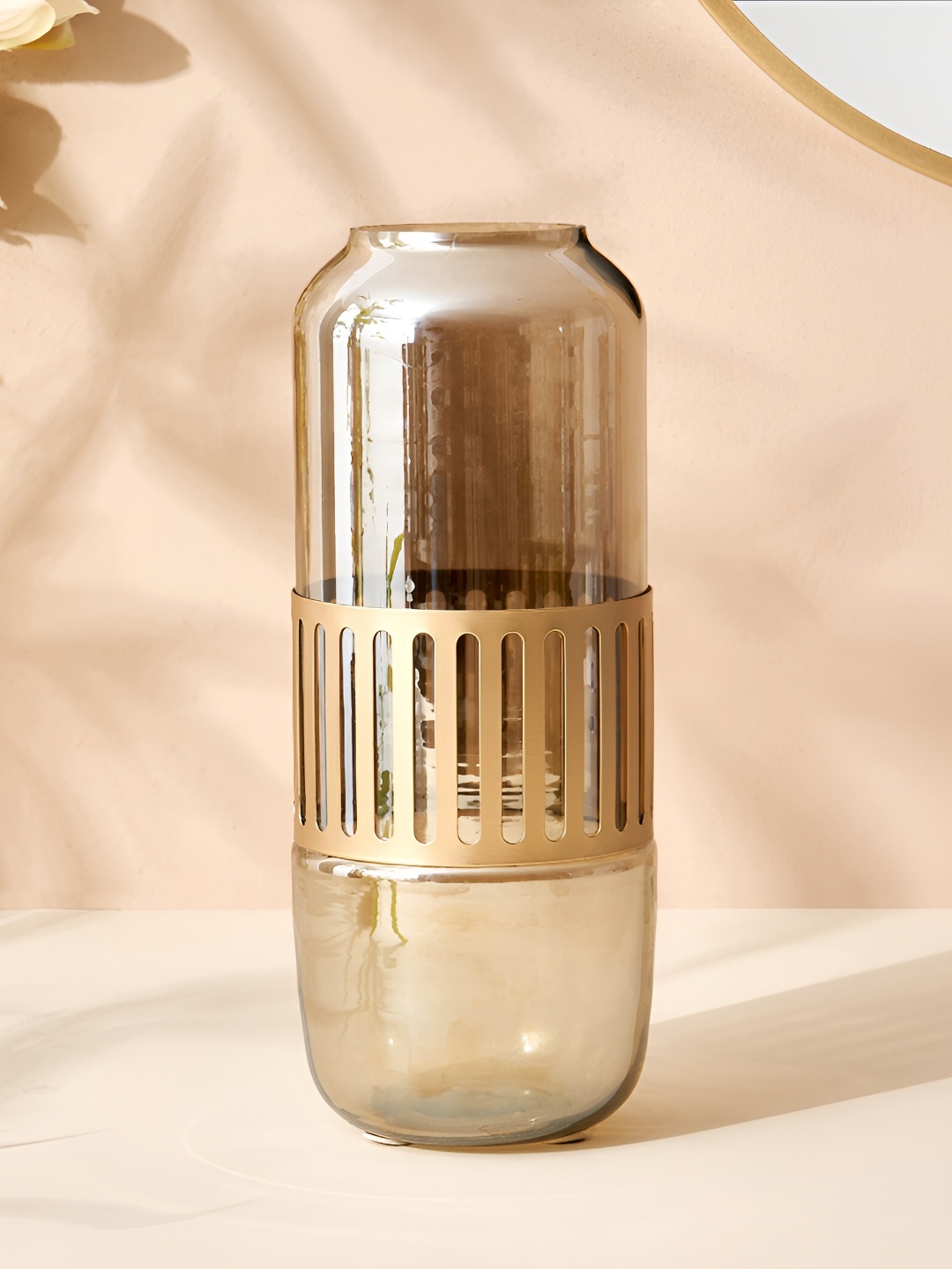 

Home Centre Leon Otto Gold Toned Cylindrical Glass Metal Vase