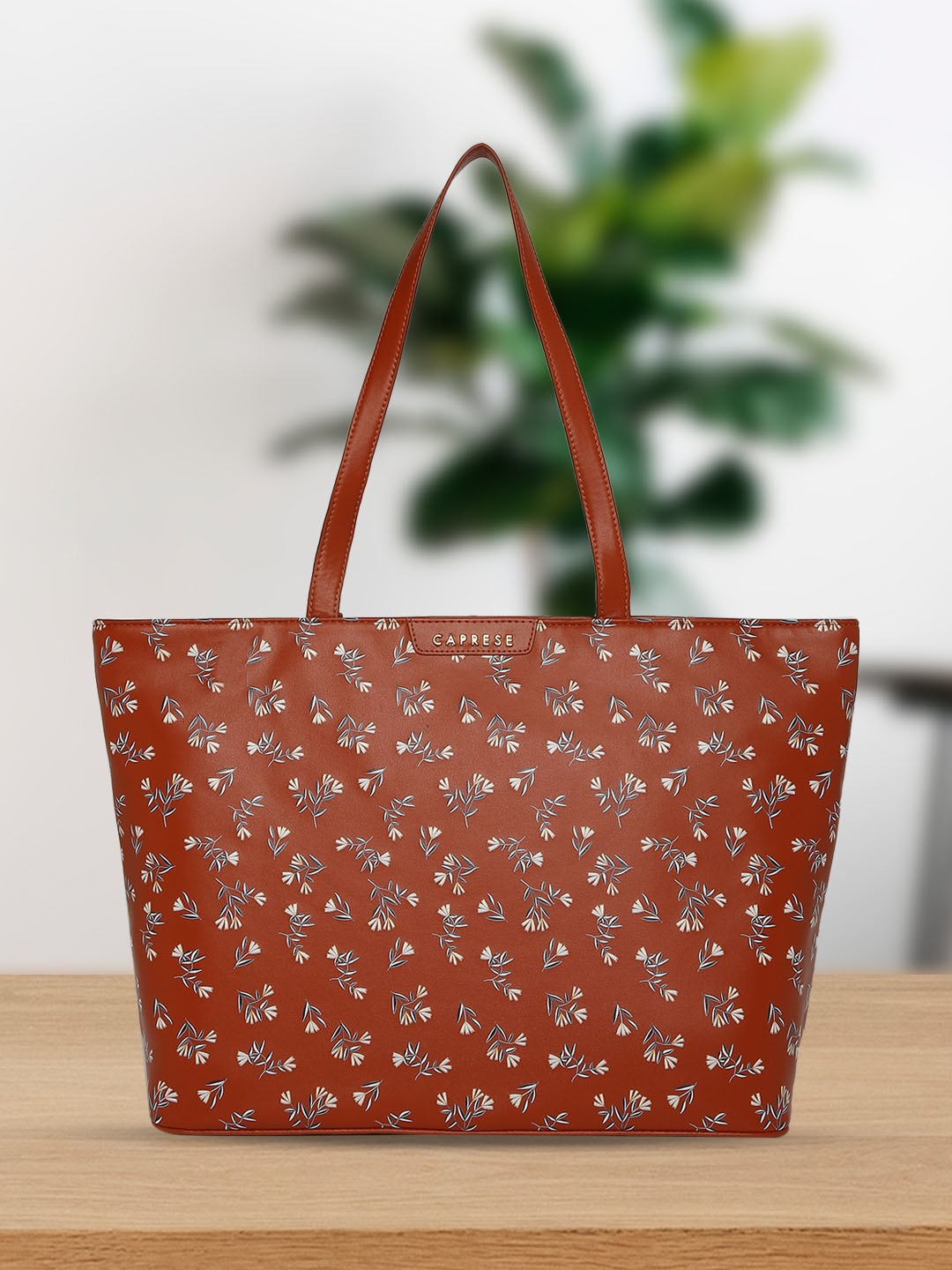 

Caprese Women's Printed PU Shopper Shoulder Bag with Cut Work, Blue