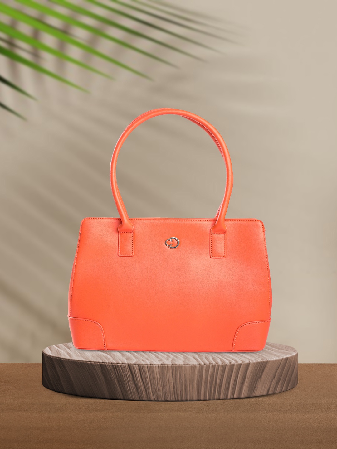 

Caprese Women Solid Structured Handheld Bag, Orange