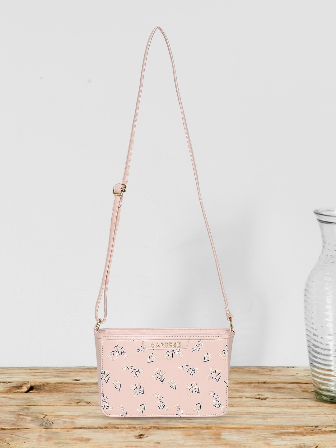 

Caprese Women Floral Printed PU Structured Sling Bag, Pink