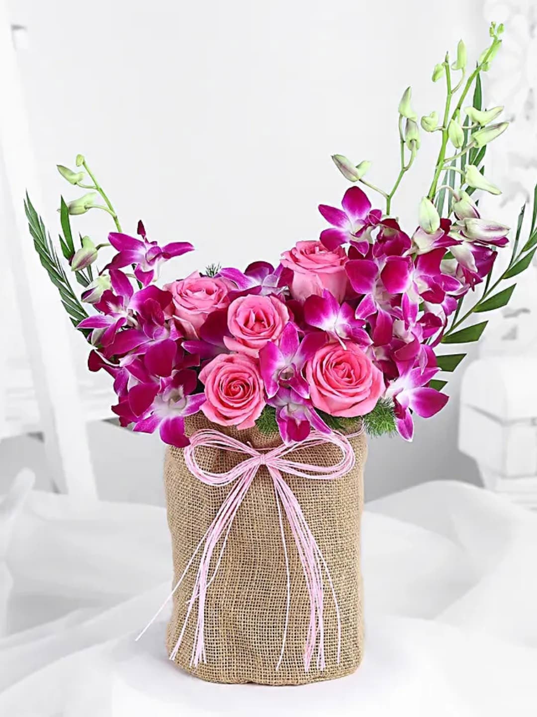 

fnp Rose & Orchid Oasis Fresh Flowers With Potli Bag, Purple