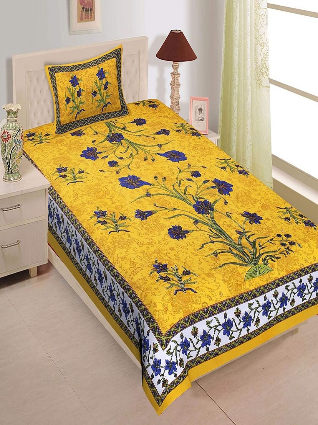 

Aura Yellow & Blue Floral Cotton 120 TC Single Bedsheet with 2 Pillow Covers