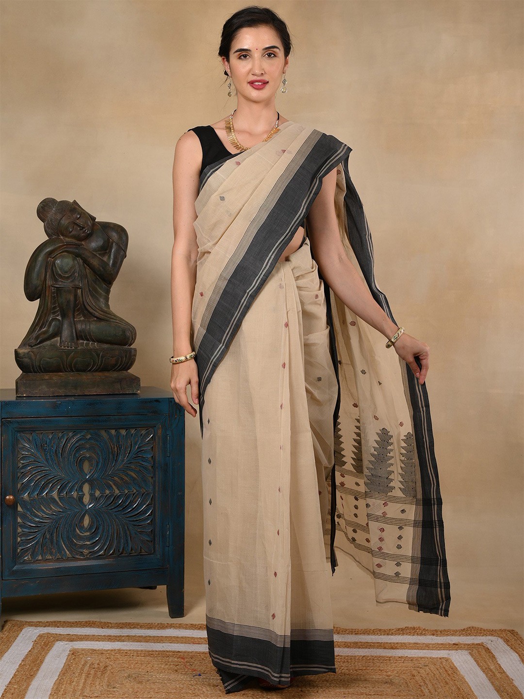 

Exotic India Taant Pure Cotton Bengali Motifs Beige Saree and Black Border