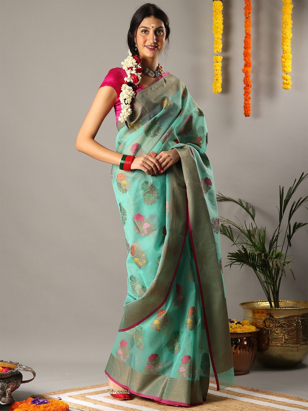 

Exotic India Kora Silk Floral Motifs Sea Green Saree