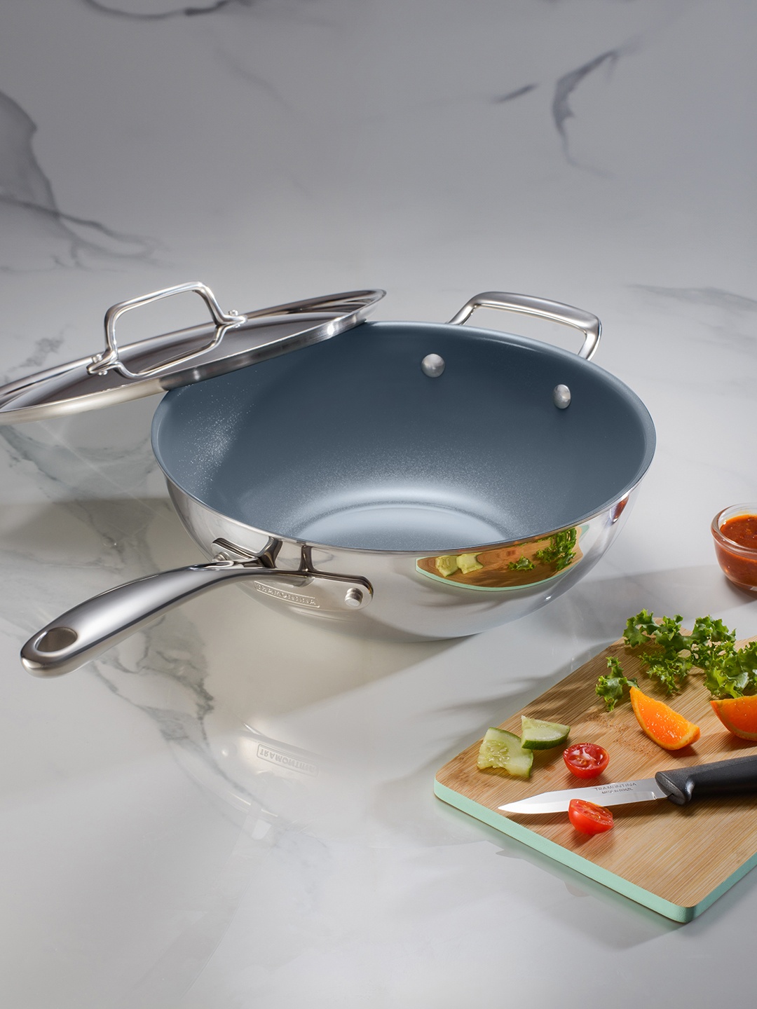 

Tramontina Fusao Non Toxic Stainless Steel Ceramic Triply Wok with Lid 26cm, Silver