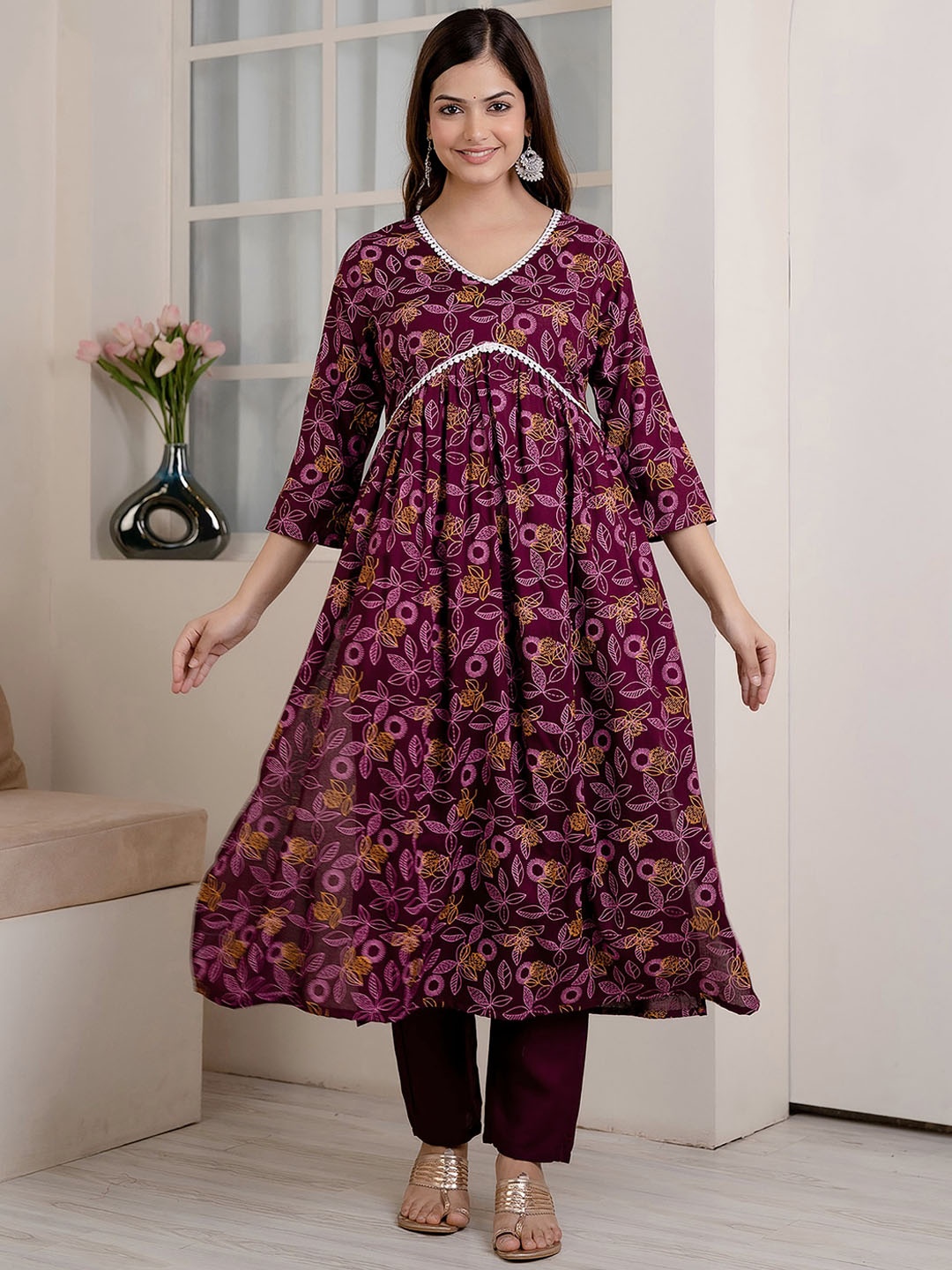 

Veshviti Women Floral Printed Pleated Thread Work Liva Kurta with Trousers, Purple