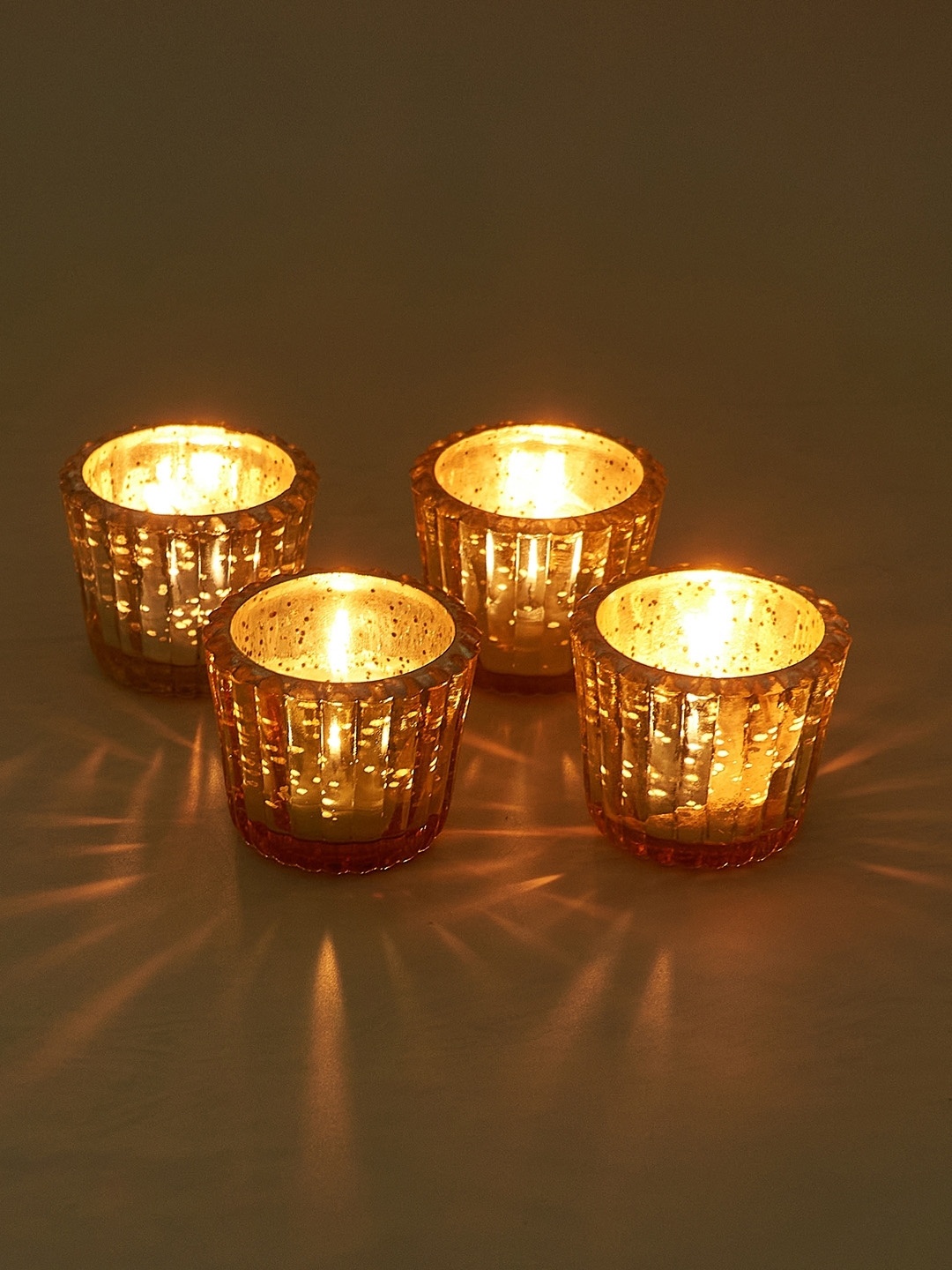 

NURTURE INDIA Gold-Toned 4 Pieces Candle Holder