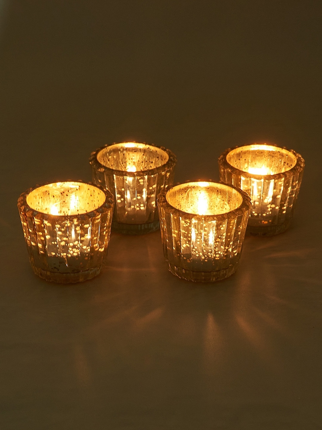 

NURTURE INDIA Silver-Toned & Blue 4 Pieces Candle Holder